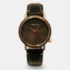 Montre Quantum en cuir et bois ébène, avec un élégant cadran noir. Un accessoire unique alliant style et sophistication.