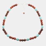 Collier Oscar en bois d'acajou et pierres naturelles turquoise, un accessoire tendance et élégant pour sublimer votre style.